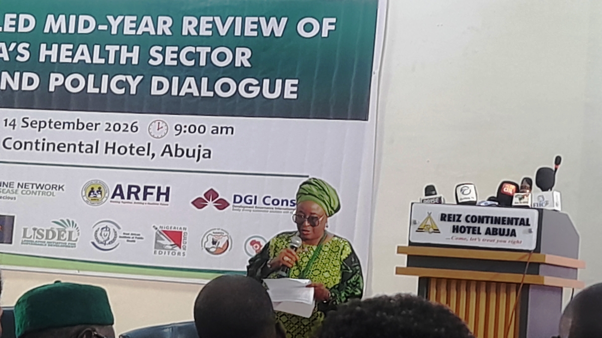 Chief Moji Makanjuola reading her address to stakeholders during the health sector reform review in Abuja